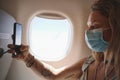 First let me take a selfie. a young woman taking a selfie in the aeroplane. Royalty Free Stock Photo