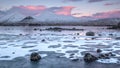 First light on a frozen Lochan na h-achlaise Royalty Free Stock Photo