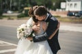 first meeting of the bride and groom on their wedding day on the road, highway in the city Royalty Free Stock Photo