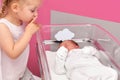 First meeting between a sister and a newborn baby in the hospital ward Royalty Free Stock Photo