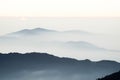 First morning sun rising in misty mountains in Himalayas Royalty Free Stock Photo