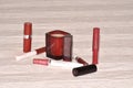 Lipstick and lip gloss in red. Royalty Free Stock Photo