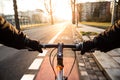 First-person view of cyclist in the city at morning Royalty Free Stock Photo