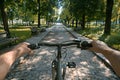 Ultra Hd Visual of FirstPerson View of Man Riding a Bike in the Park Royalty Free Stock Photo