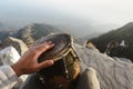 First person view on drums playing hand in the Triund peak mountain in Himalayas