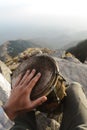 First person view on drums playing hand in the Triund peak mountain in Himalayas