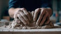 First-Person View of Hands Sculpting Clay into Abstract Form on Worktable Royalty Free Stock Photo