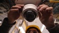First-Person View of Installing Dome CCTV Camera on Indoor Ceiling Royalty Free Stock Photo