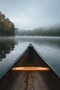 first person view of kayak boat at mountain lake with fog, pov canoe at misty river Royalty Free Stock Photo