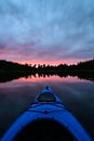 First person view of kayaking in a magical sunset evening on a lake Royalty Free Stock Photo