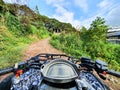 First person view in the middle of the jungle, ATV driver in the mud. Adventure trip in the forest. Soft focus. Man on