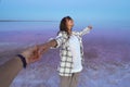 First person view, POV delighted woman on colorful dreamy lake, girl holding mans hand