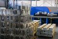 The first phase of metal and aluminum processing. Processed products from CNC machines stacked on a pallet in a large Royalty Free Stock Photo