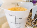 The first photo in a series of fried rice recipes. Place 400 milligrams of rice in a measuring cup