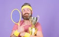 First place. Sport achievement. Tennis champion. Win tennis game. Celebrate victory. Athletic man hold tennis racket and