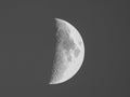 First quarter moon seen with telescope in black and white Royalty Free Stock Photo