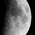 First quarter moon seen with telescope in black and white Royalty Free Stock Photo