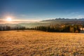 The first rays of the rising sun over the autumnal Tatra Mountains. The pass over Lapszanka. Poland Royalty Free Stock Photo