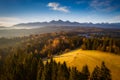 The first rays of the rising sun over the autumnal Tatra Mountains. The pass over Lapszanka. Poland Royalty Free Stock Photo