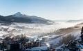 First shadows of setting sun on winter ski resort Carpathians