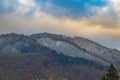 First snow covering autumn forest on mountain slope Royalty Free Stock Photo