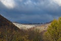 First snow covering autumn forest on mountain slope Royalty Free Stock Photo