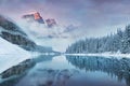 First snow Morning at Moraine Lake in Banff National Park Alberta Canada. Snow-covered winter mountain lake in a winter atmosphere