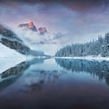 First snow Morning at Moraine Lake in Banff National Park Alberta Canada. Snow-covered winter mountain lake in a winter atmosphere Royalty Free Stock Photo