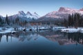 First snow Almost near perfect reflection of the Three Sisters Peaks in the Bow River. Canmore in Banff National Park Canada Royalty Free Stock Photo