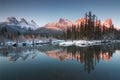 First snow Almost near perfect reflection of the Three Sisters Peaks in the Bow River. Canmore in Banff National Park Canada Royalty Free Stock Photo