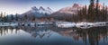 First snow Almost near perfect reflection of the Three Sisters Peaks in the Bow River. Canmore in Banff National Park Canada Royalty Free Stock Photo