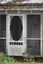 Screen Door with White rockers on the porch Royalty Free Stock Photo