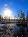 First snow in northern Finland, fall season, early winter. River and bright sunlight