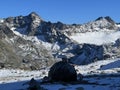 First snow on the rocky mountain peaks Piz Sarsura Pitschen (3132 m) and Piz Sarsura (3176 m) Royalty Free Stock Photo
