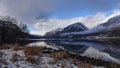 First snowfall at Vangmjose lake near Vang in autumn in Norway Royalty Free Stock Photo