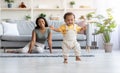 First Steps. Adorable Black Infant Child Walking In Living Room At Home Royalty Free Stock Photo