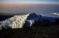 Mystic sun rise on the Kilimanjaro- the first sun rays meet  the ice of the glacier Royalty Free Stock Photo