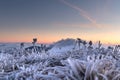 First sunlight on a early cold winter morning with frozen grass landscape and bright foggy glow. Misty winter morning Royalty Free Stock Photo