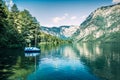 First sunlight glowing surface of Bohinj lake. Beautiful summer scene of Triglav national park. Great morning view of Julian Alps Royalty Free Stock Photo