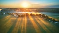 First sunrays over green meadow and field. Sunny summer calm morning panorama Royalty Free Stock Photo