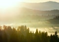 First sunrise rays of sun in Carpathian mountains. Royalty Free Stock Photo