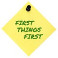 First Things First reminder green marker handwritten motivational text, important crucial business priority action planning