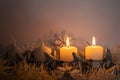 The first two candles burning on a home made advent wreath Royalty Free Stock Photo