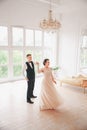 First wedding danc.wedding couple dances on the studio. Wedding day. Happy young bride and groom on their wedding day. Royalty Free Stock Photo