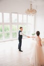 First wedding danc.wedding couple dances on the studio. Wedding day. Happy young bride and groom on their wedding day. Royalty Free Stock Photo
