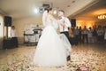 First wedding dance of newlywed couple in restaurant