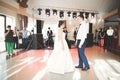 First wedding dance of newlywed couple in restaurant