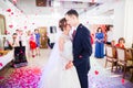 First wedding dance of newlywed couple in restaurant