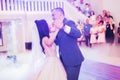 First wedding dance of newlywed couple in restaurant Royalty Free Stock Photo