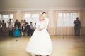 First wedding dance of newlywed couple in restaurant